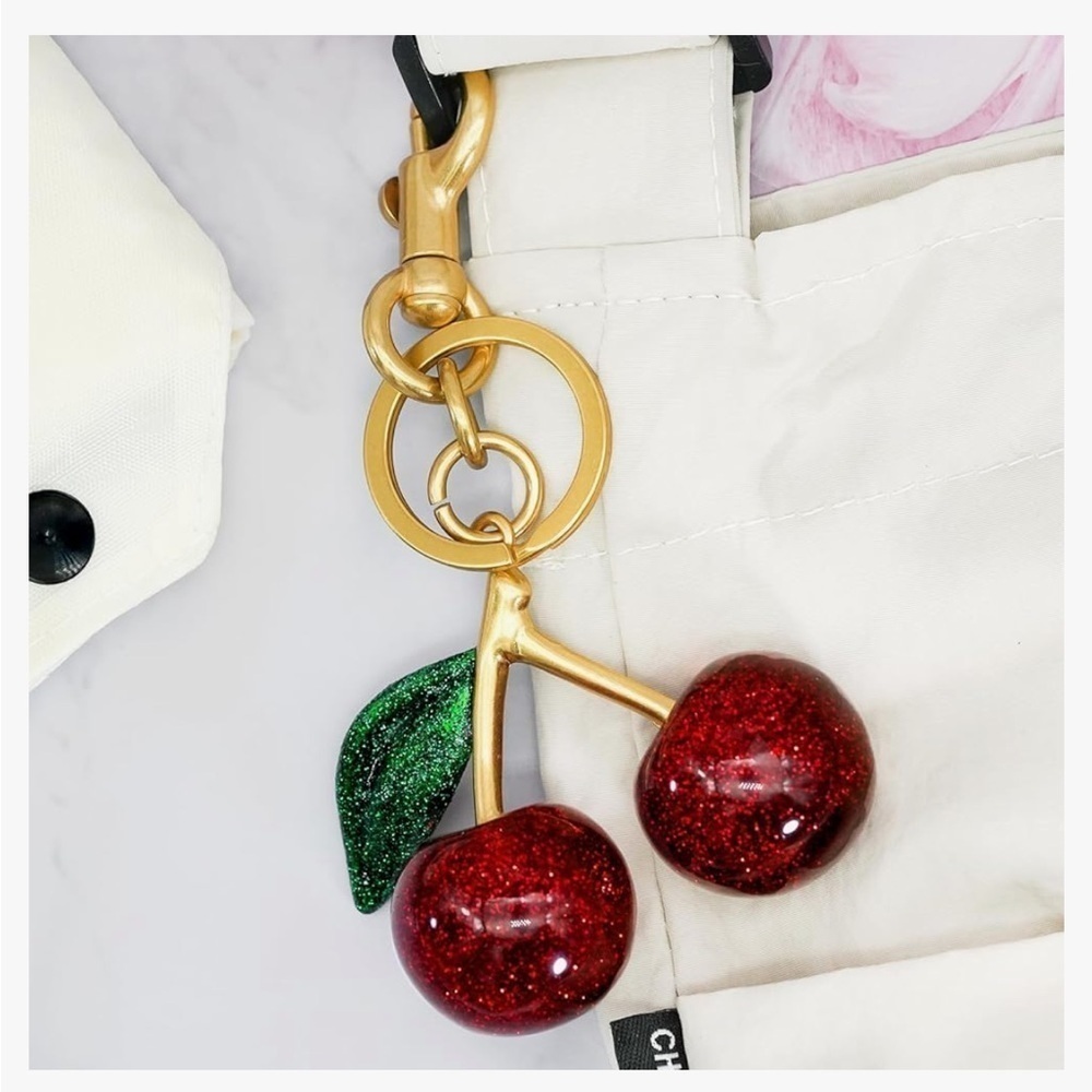 Cherry bag charm keychain with gold hardware clips onto your coach bag or ju…